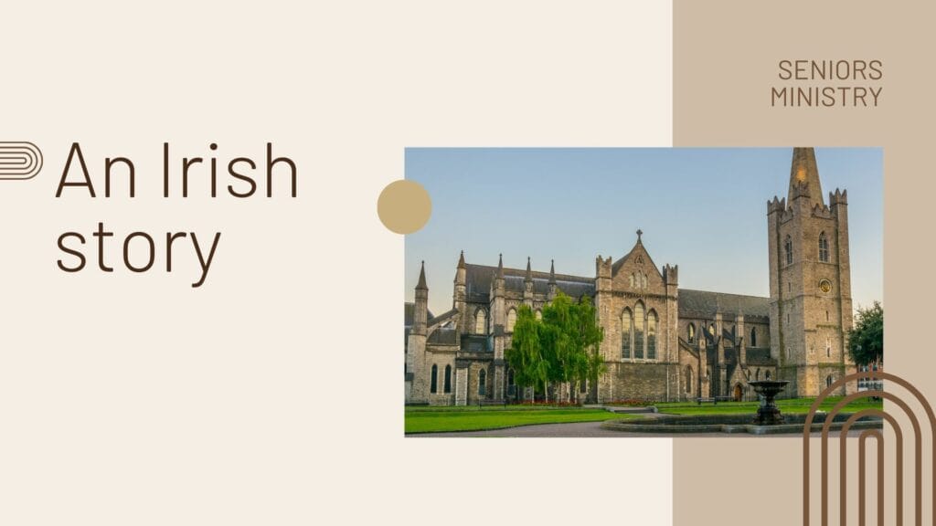 Old Irish beautiful building with green grass and hedges in the front