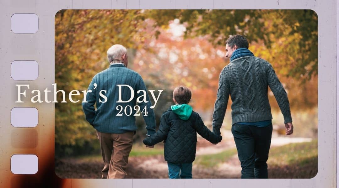 Fathers Day Sunday 1st September. Image of grandpa, adult son and young boy holding hands walking with autumn trees around them.