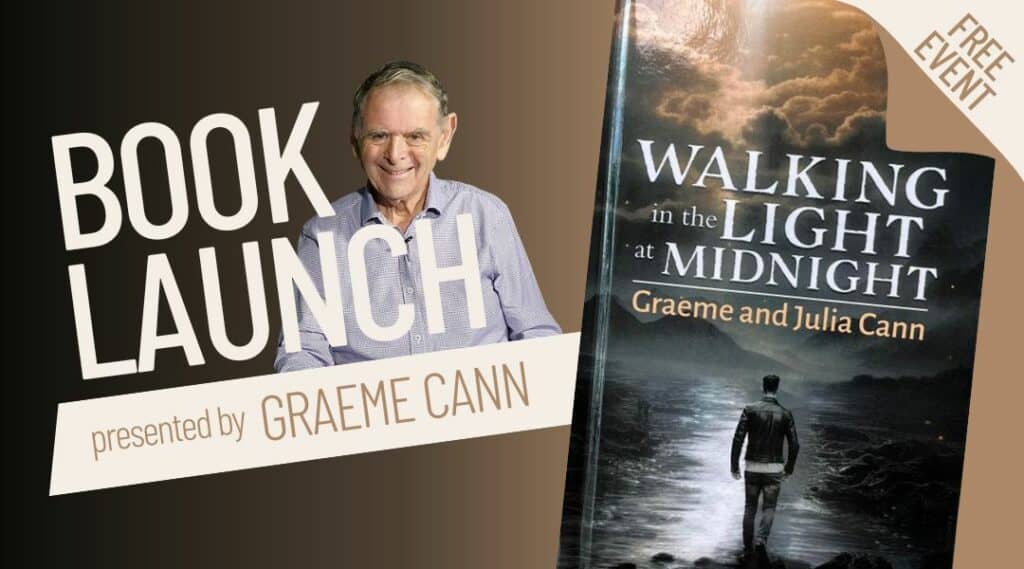 Image of a book called Walking in the light at midnight. Dark cover with man walking in water. Graeme Cann photo beside the book and he is in his eighties wearing a shirt.