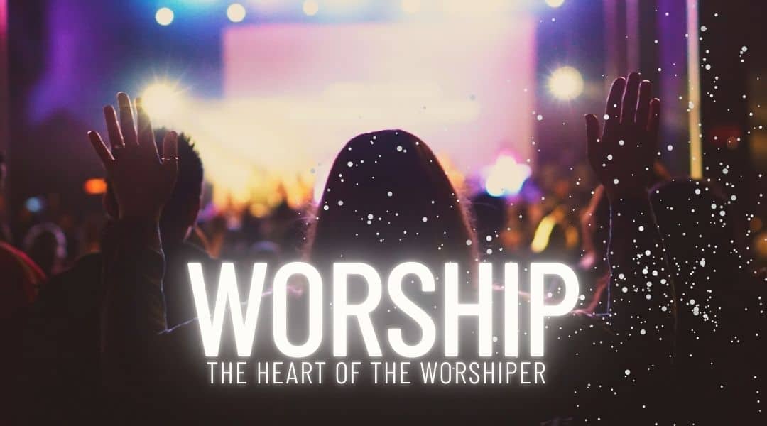 Image of people worshipping as a group with their arms are up in the air. Worship the heart of the worshiper.