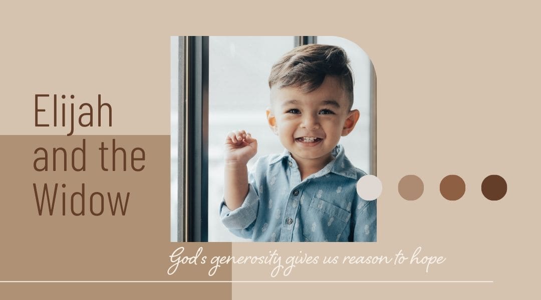 Image of a young four year old boy wearing a blue denium shirt smiling.