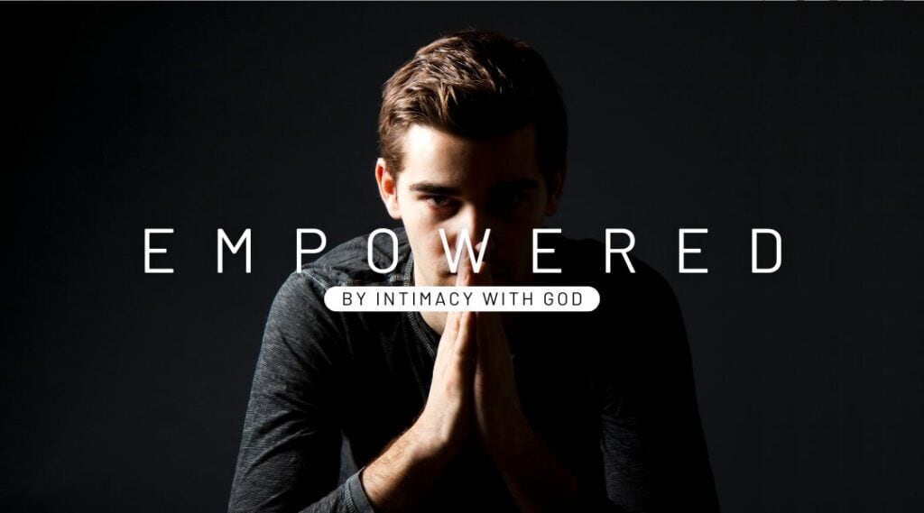 Image of a twenty year old man wearing a black long sleeve top praying. Empowered by intimacy with God.