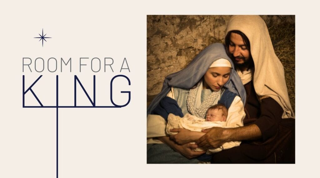 Image of Mary and Joseph holding baby Jesus in a manger.