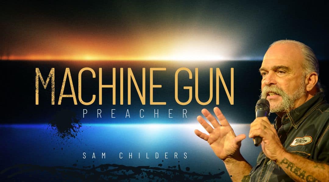 Image of The Machine Gun Preacher Sam Childer. A senior man wearing bikie clothing and his hair in a ponytail.