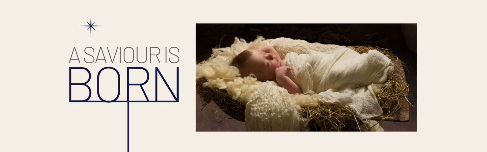 Image a baby Jesus lying in a crib full of hay and cloth.