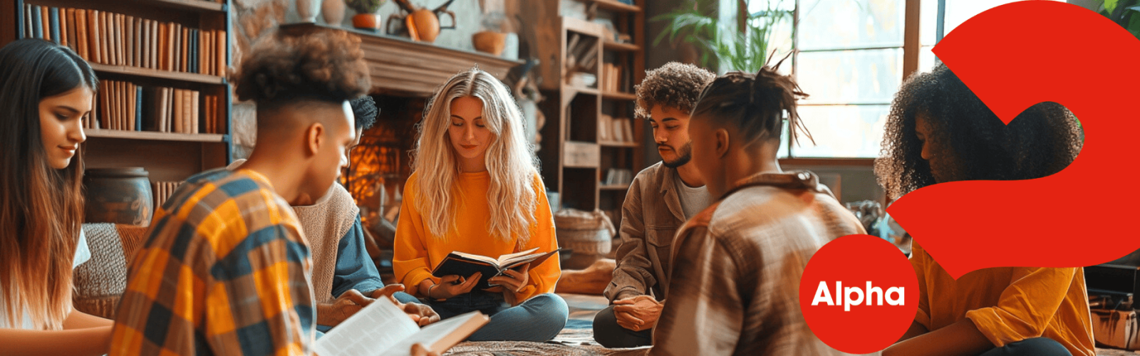 A photo of adults sitting in a circle on the floor reading out of the bible sharing stories and asking questions about Alpha Course
