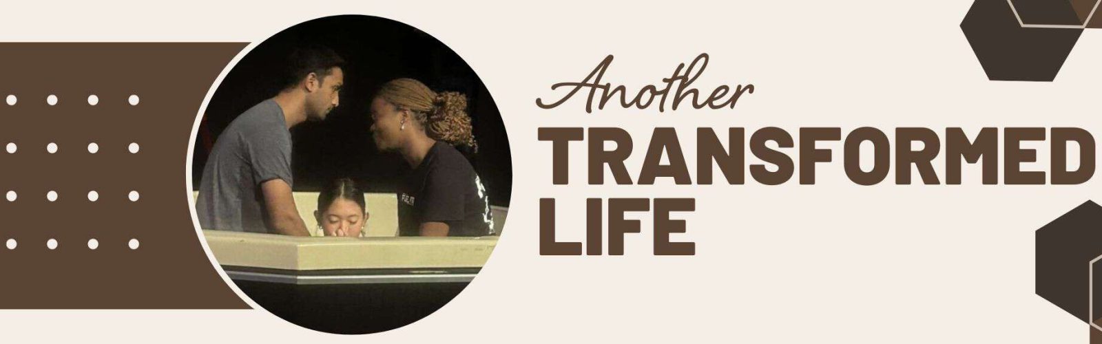 Another transformed life. Image of a young girl about twelve years old getting baptised under the water with two helpers.