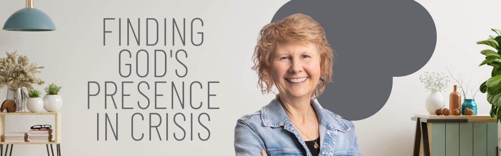 Image of Pastor Glennie wearing a denium jacket and black tshirt. Blonde hair with a big smile. Green plants and wall unit behind her.