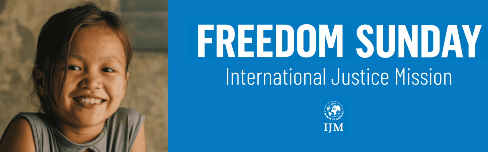 Young six year old girl smiling wearing a singlet sitting on the dirty ground. Title: Welcome to Freedom Sunday IJM.