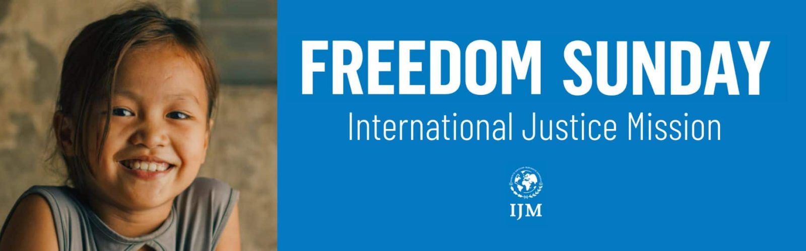 Image of a young seven year old girl looking happy wearing a grey top.