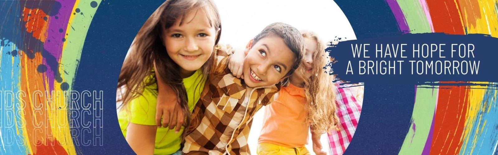 Image of young happy kids playing with a circle of colour around them