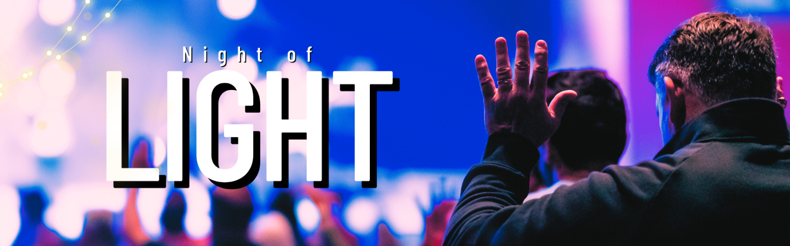 Photo of a group of people from behind. They have their hands raised in worship. Title: Night of light.