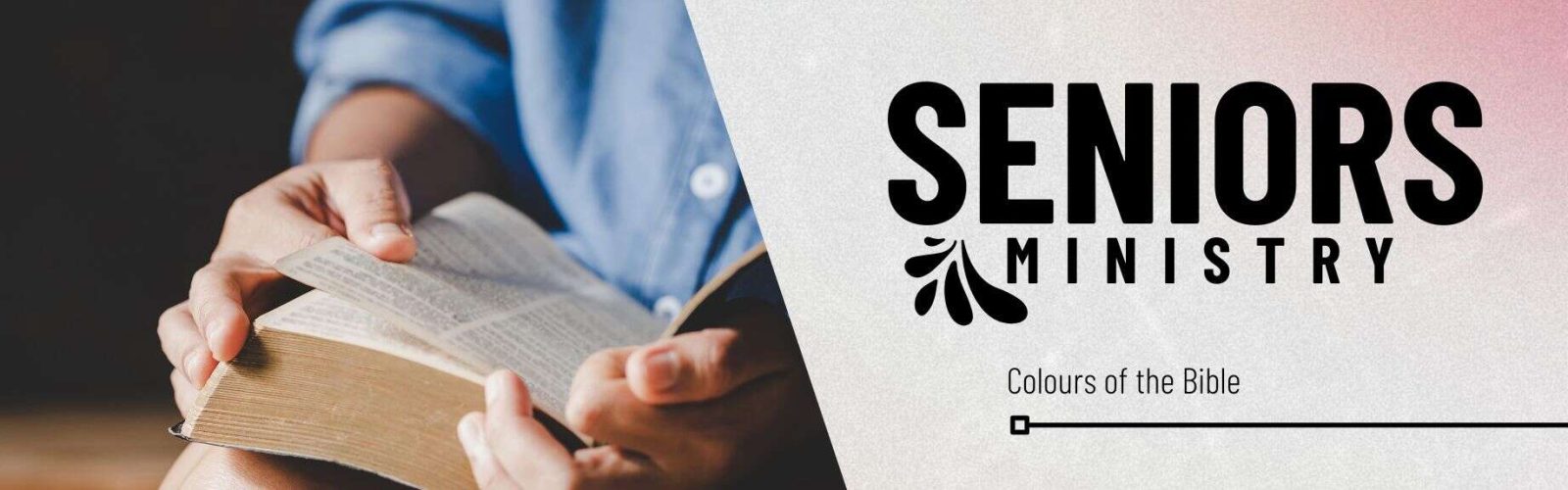 Image of a mans hand reading a bible close up. The man is wearing a blue shirt.