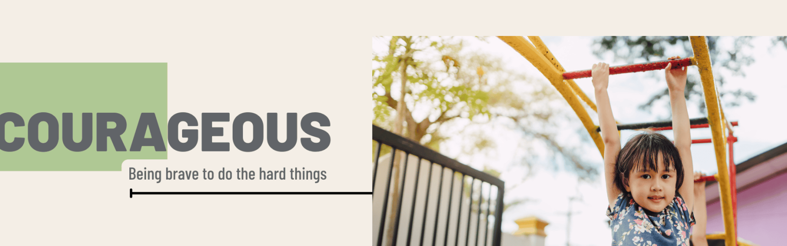 Image of a young girl wearing a floral dress hanging from the monkey bars in a playground.
